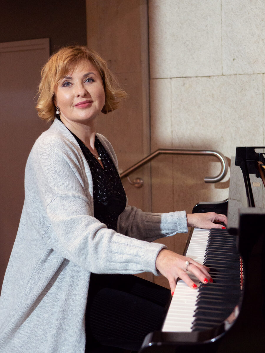 Natalie Mitz, founder and director, at the piano