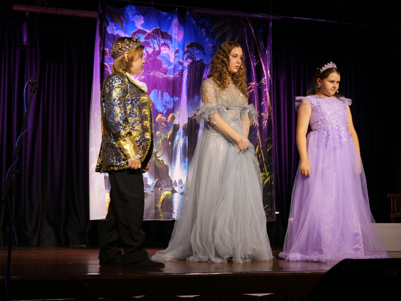 Cast members in costume during a scene from a Musical Island Productions show