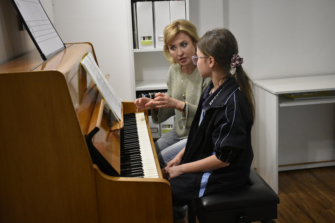 Natalie Mitz teaching a student at the piano